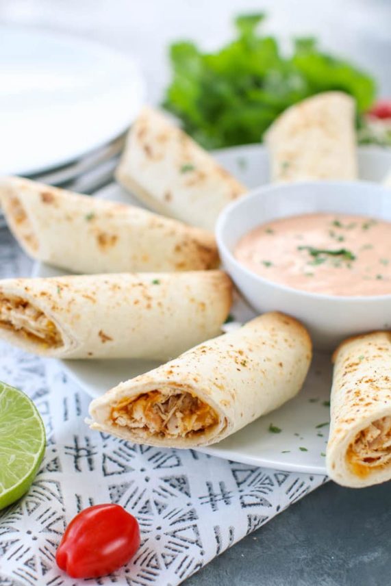 Large spread of Cheesy Chicken Taquitos