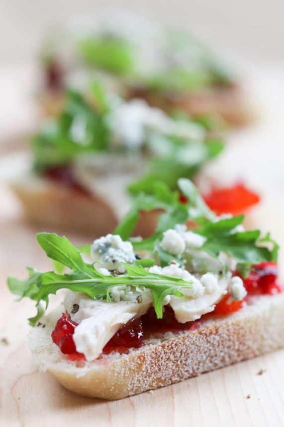 Adding the finishing touches to Roasted Turkey and Blue Cheese Crostini