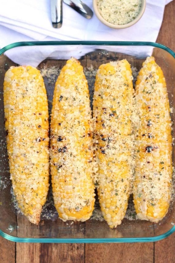 Preparing a tray of Cheesy Ranch Corn on the Cob
