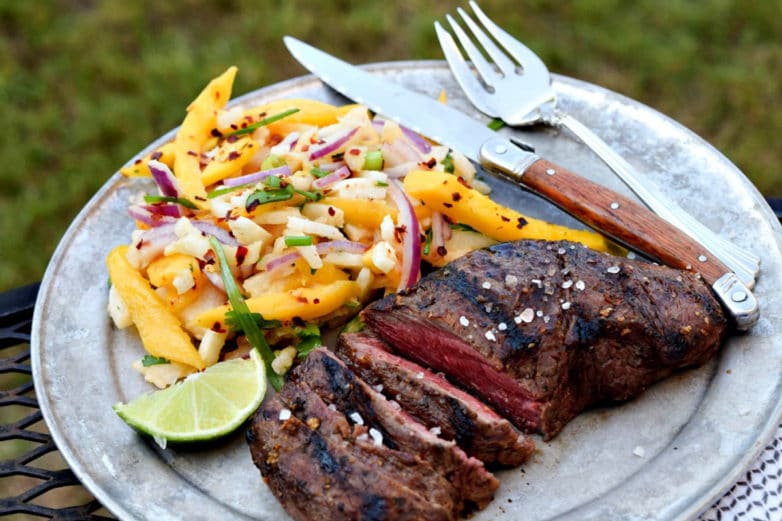 Plate of Mango-Marinated Flat Iron Steak with Fruity Ginger Jicama Slaw