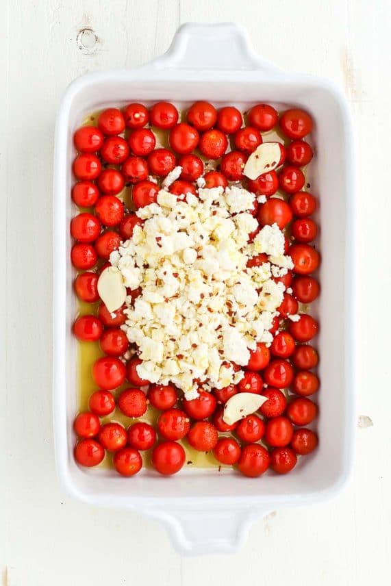 Preparing a tray of Baked Feta Pasta