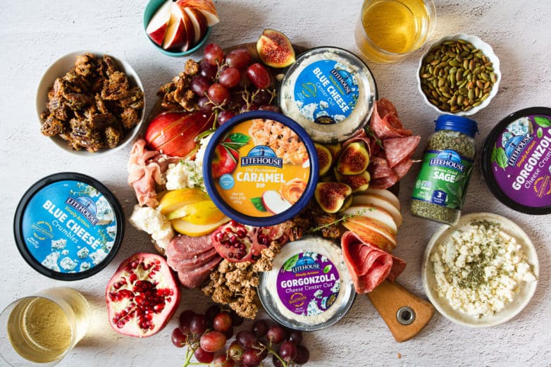 Harvest Charcuterie Board recipe with fruits, nuts, caramel sauce, blue cheese, gorgonzola, and more.