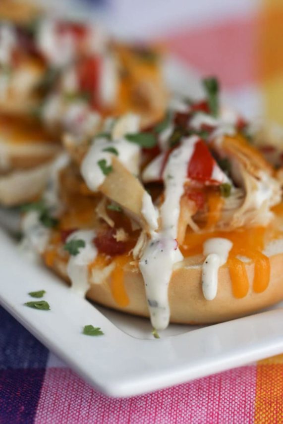 Drizzling ranch on Chicken Bacon Ranch Bagel Bites