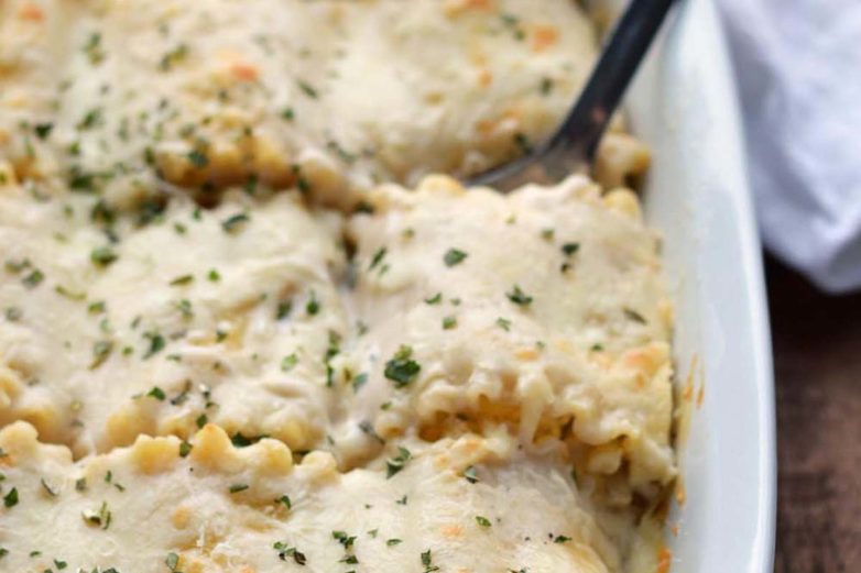 Scooping out some Basil and Ricotta Lasagna Rollups